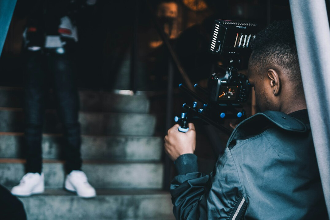 person filming content