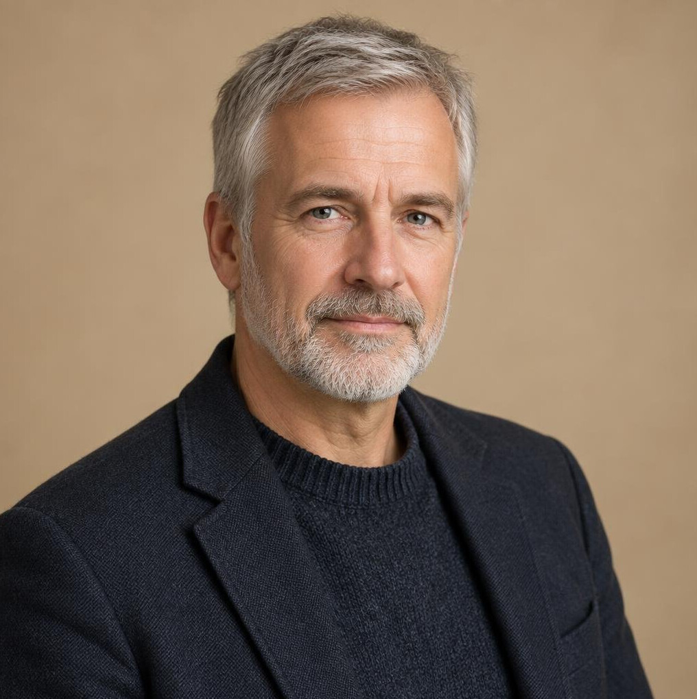 German male researcher in his fifties with grey hair